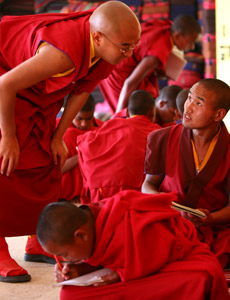 Mingyur Rinpoche speaking with a young monk